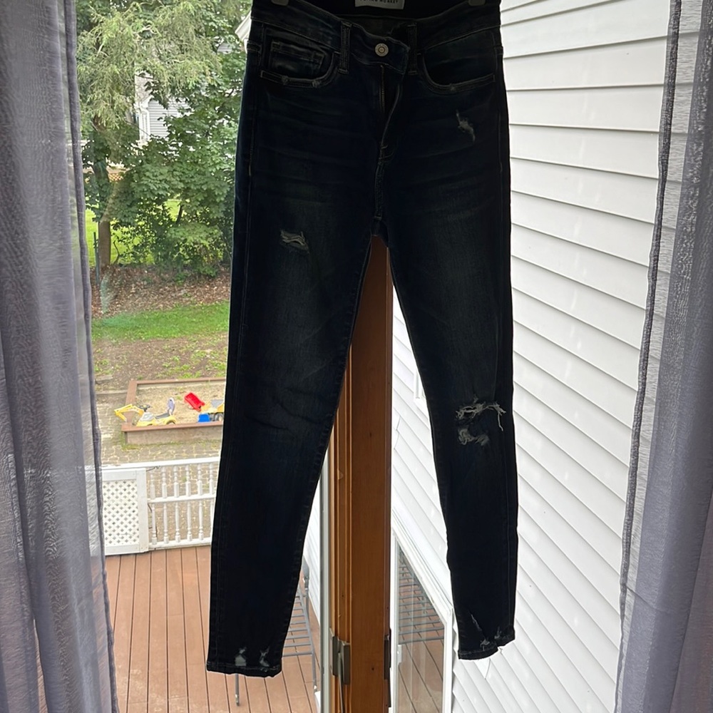 Flying Monkey distressed dark wash jeans.